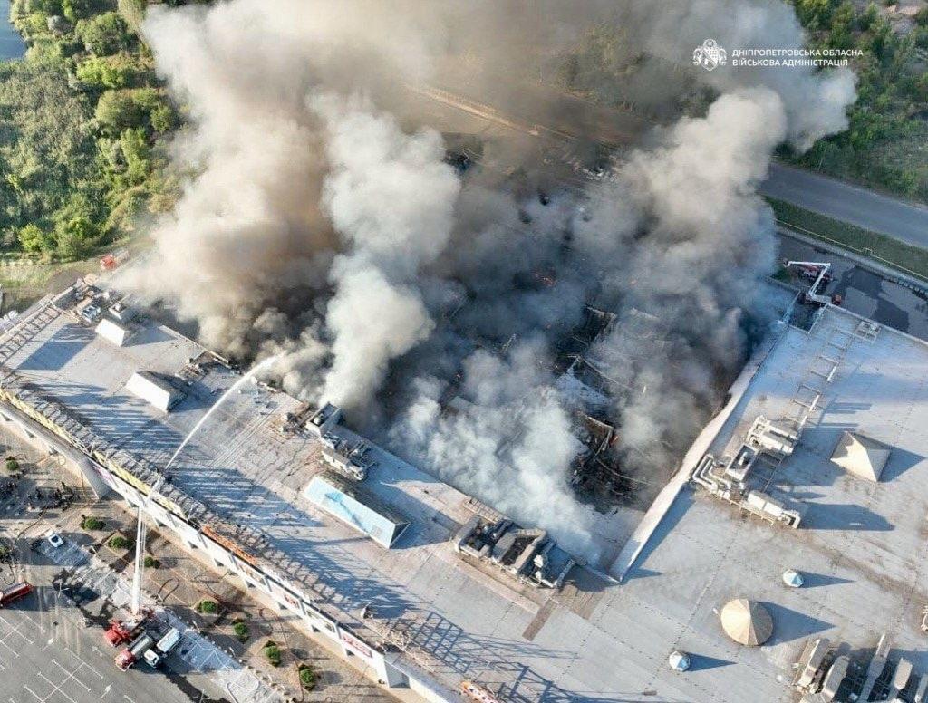 Firefighters work on a fire at a shopping mall following a Russian drone attack