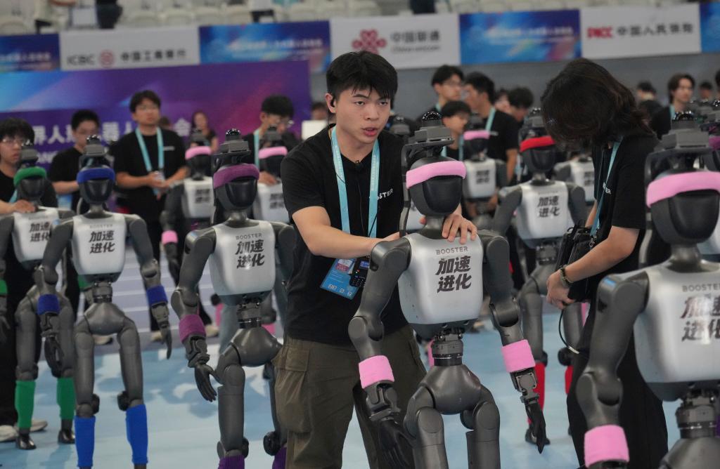 Robots are prepared ahead the opening ceremony of the World Humanoid Robot Games in Beijing