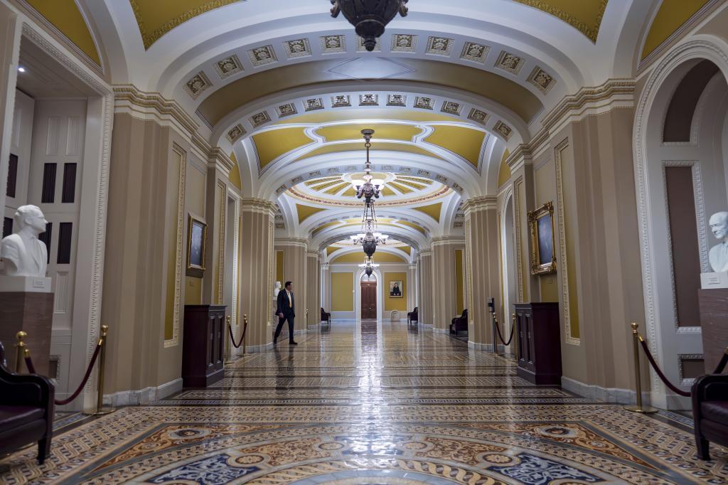 The empty corridor outside the chamber is seen after the Senate