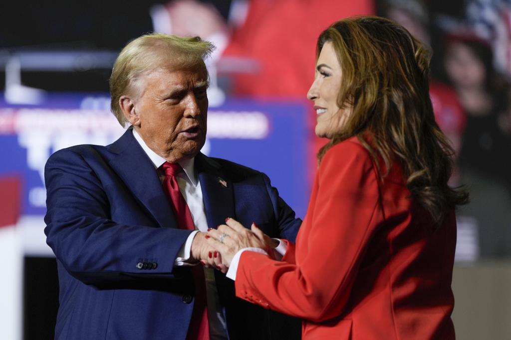 Republican presidential nominee former President Donald Trump greets Puerto Rico's shadow U.S. senator, Zoraida Buxo