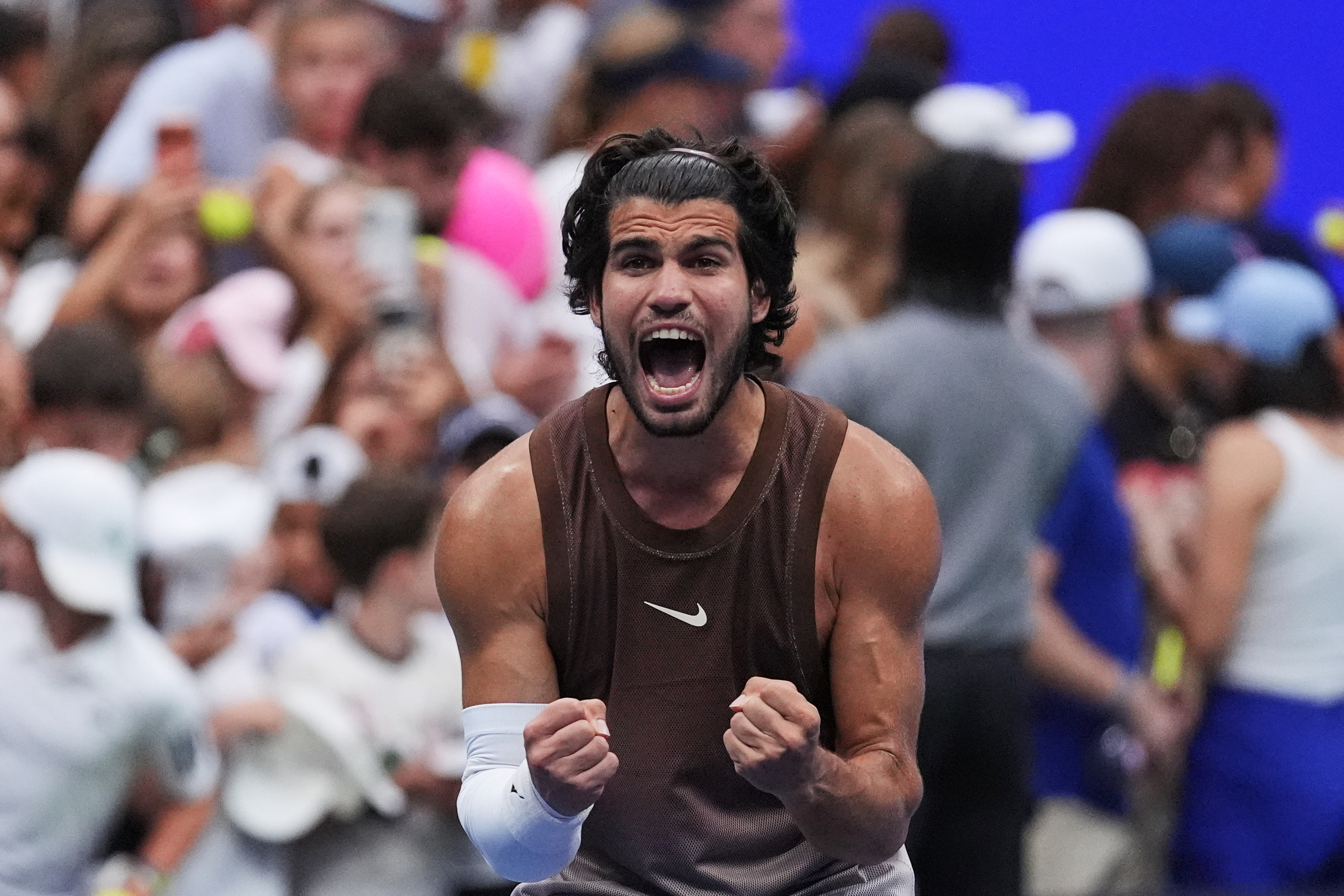 Carlos Alcaraz, of Spain, celebrates winning a match against Roman Safiullin.