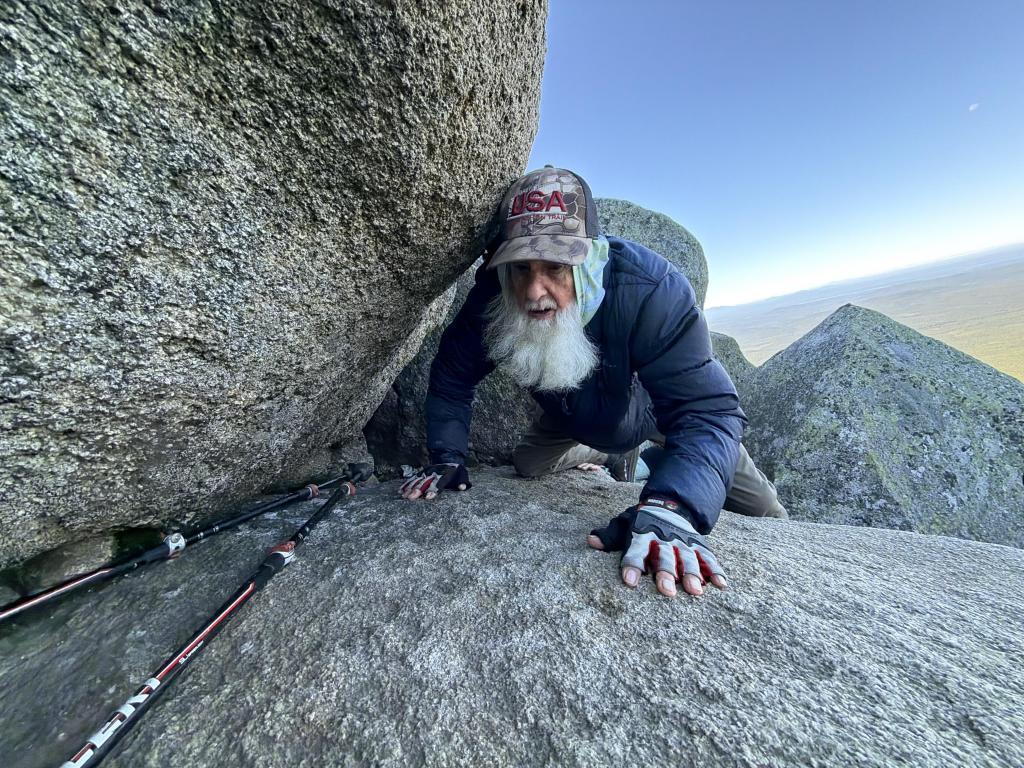 Dale Sanders, 91, climbs a section of Mt. Katahdin