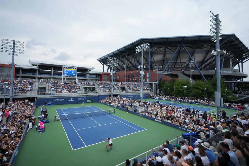 Carol Young Suh Lee, of the United States, returns the ball to Katie Boulter, of Britain