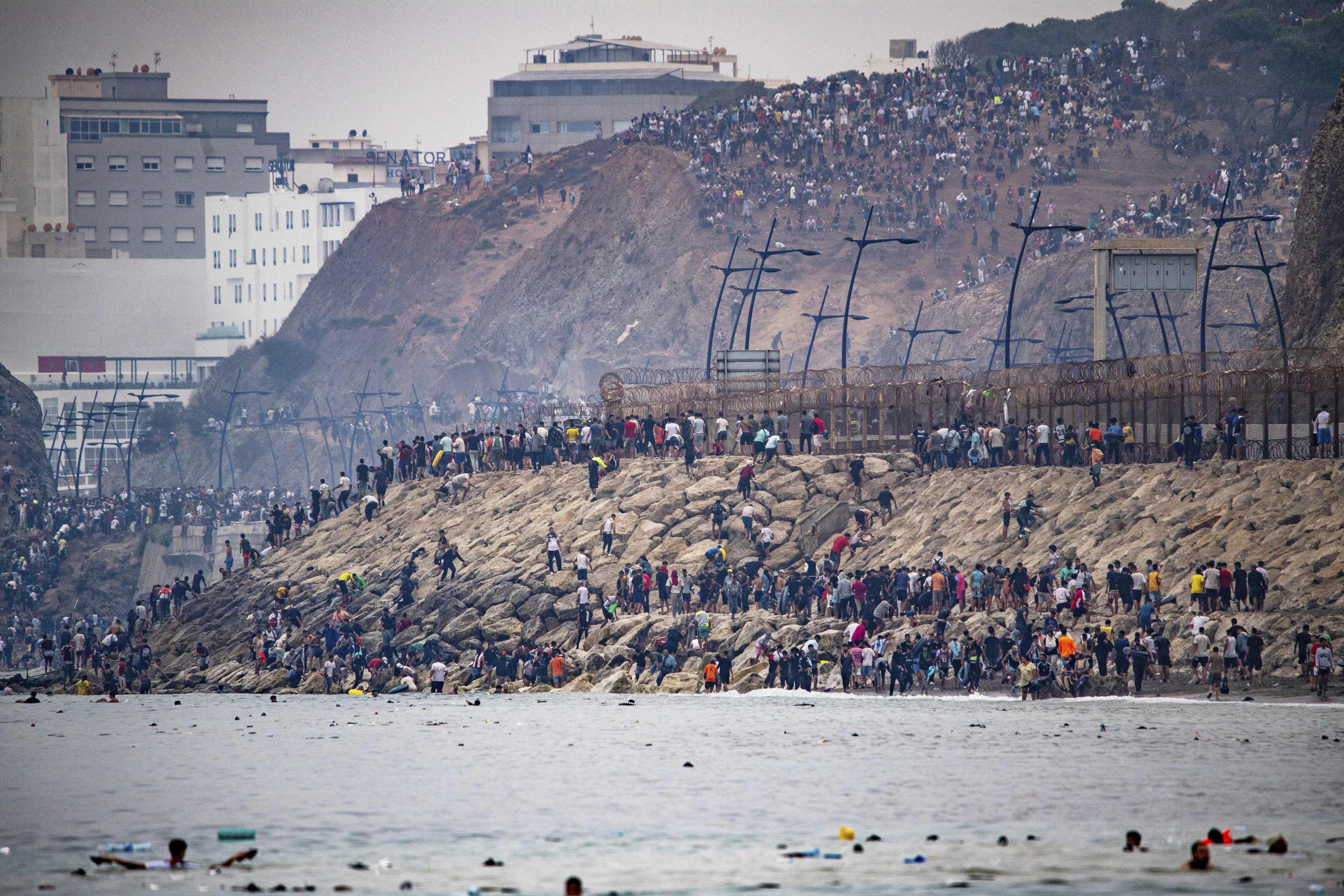 Migrants return to Morocco from the Spanish enclave of Ceuta.