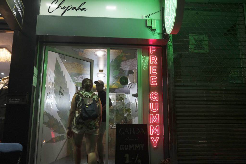 Tourists enter a newly-legal cannabis shop.