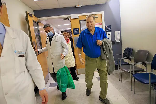 Tim Andrews, the transplanted patient, leaving the hospital.