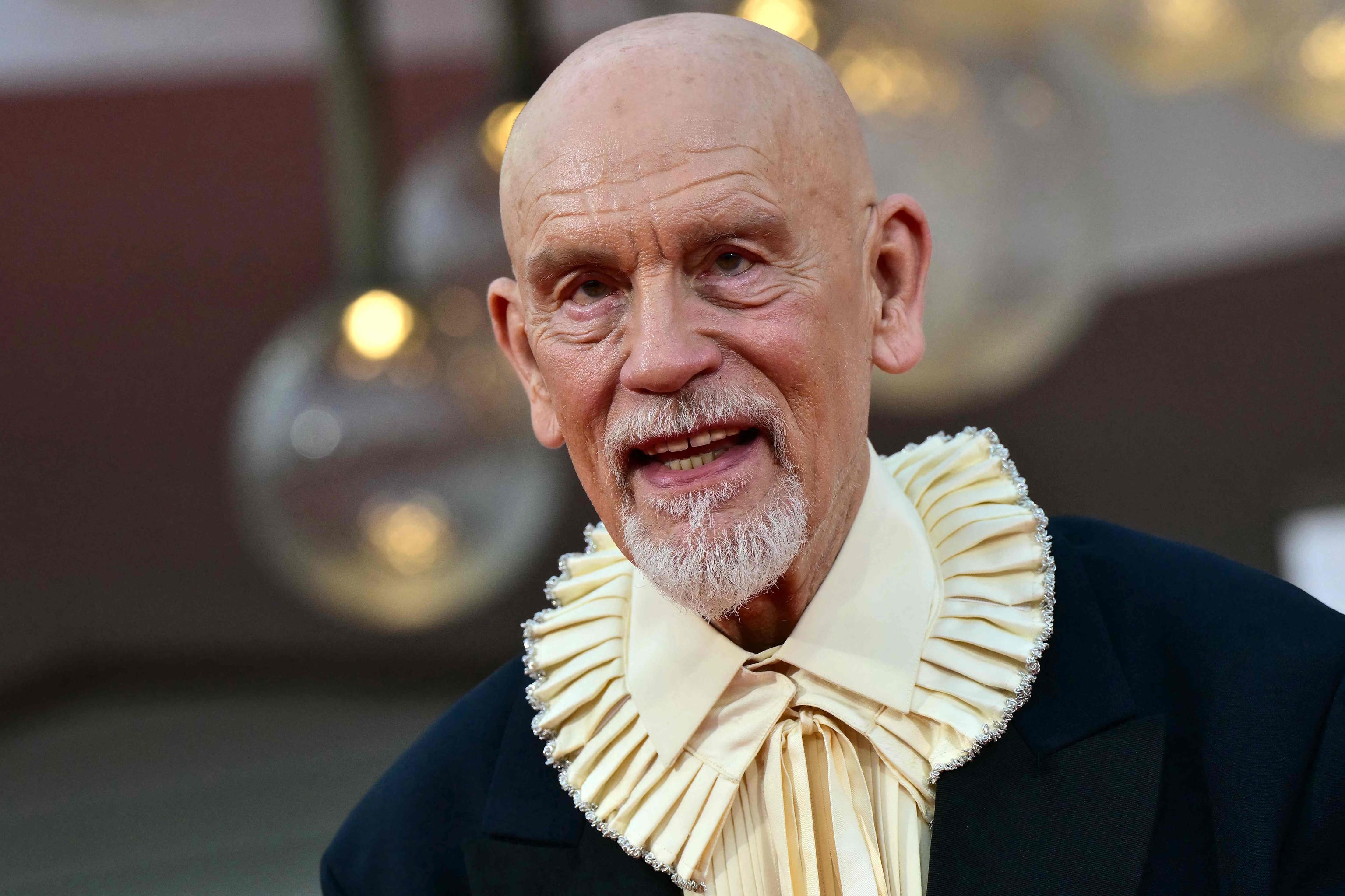 Actor John Malkovich poses at the Venice Film Festival.