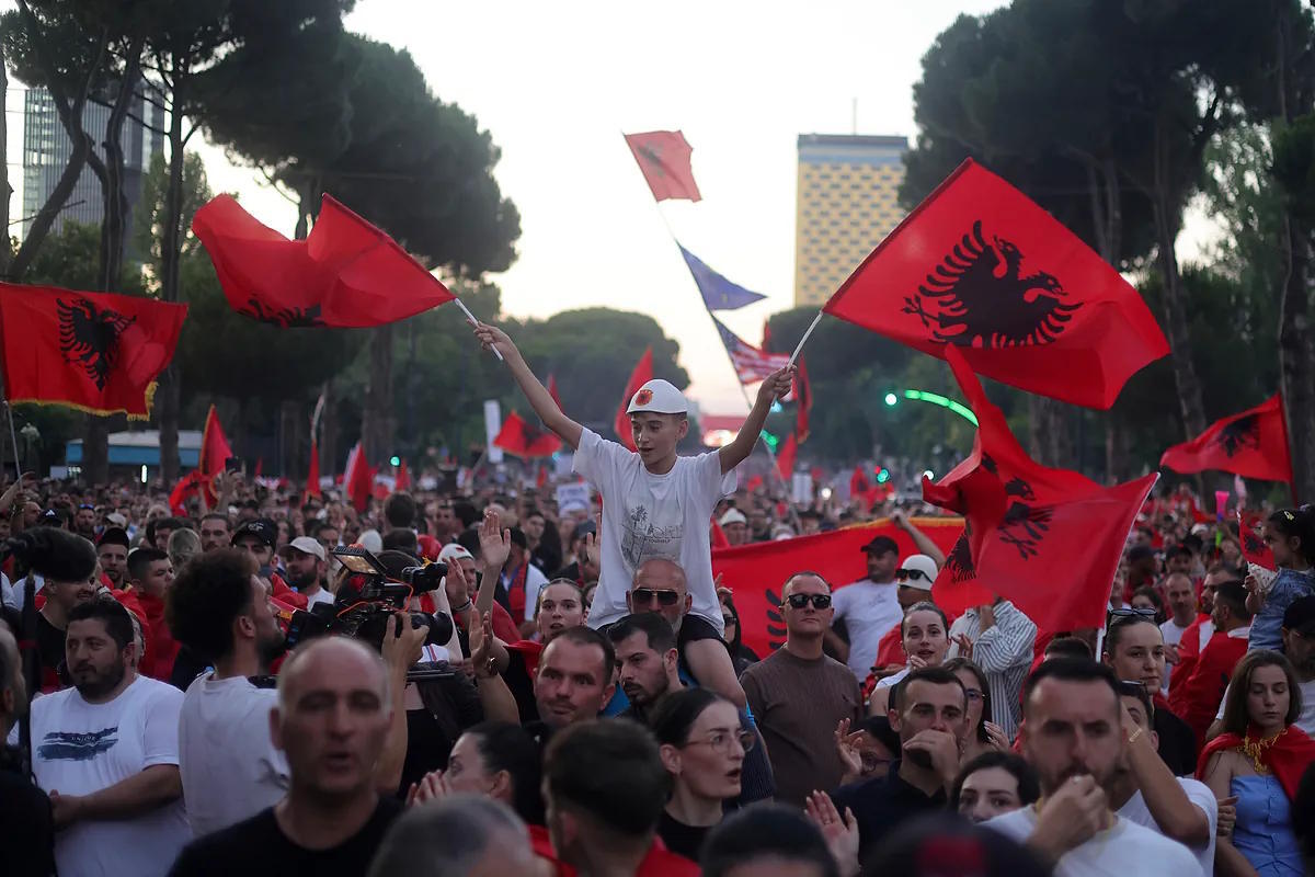 A child waves Albanian flags during one of the protests held in Tirana against Jared Kushner's projects.