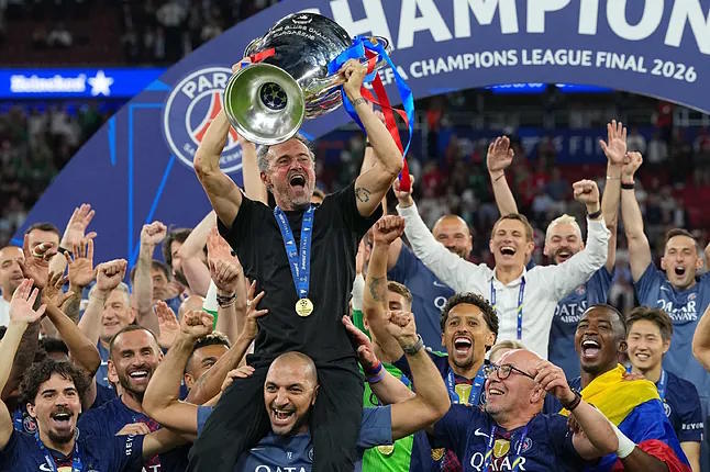 Luis Enrique, with the latest Champions League trophy.