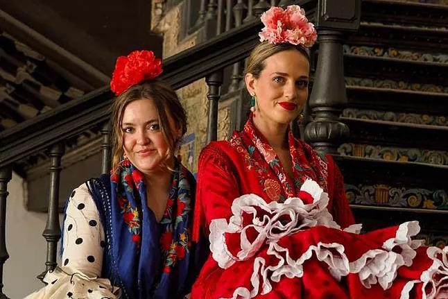 On the left in the photo, Sophie and on the right, Shelby, both dressed as "gitanas" for La Feria.