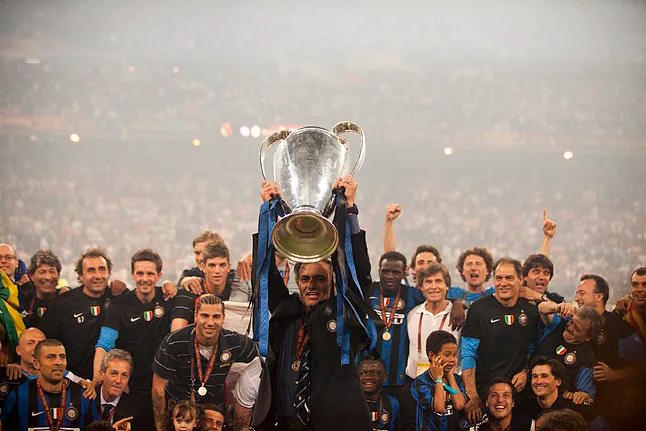 Mourinho lifts the 2010 Champions League trophy with Inter.