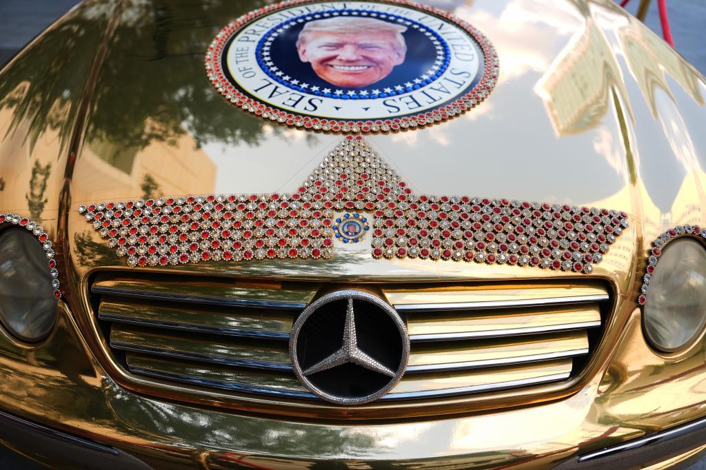 A Mercedes decorated with images of President Donald Trump