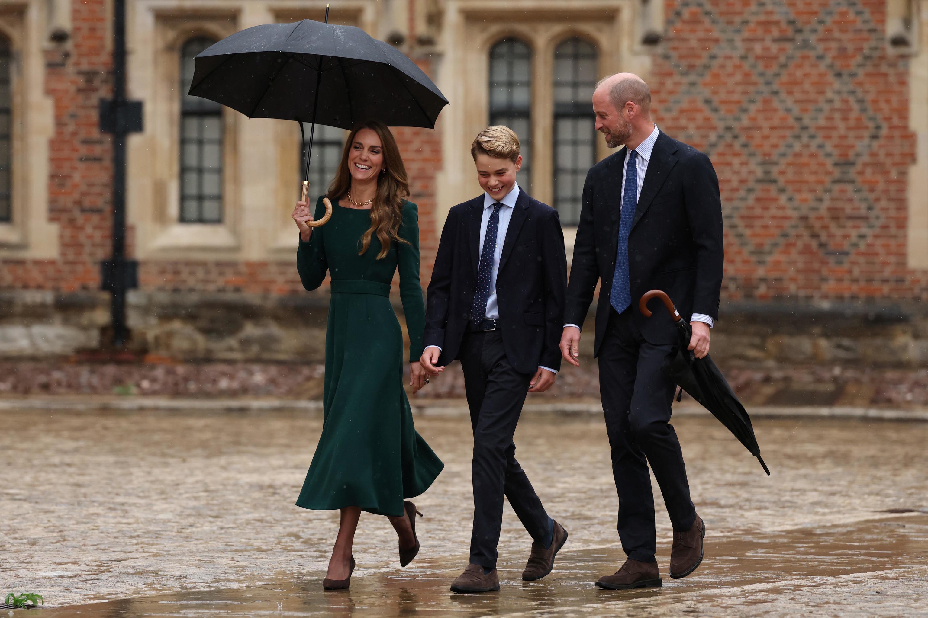 Britain's Kate, Princess of Wales and Britain's Prince William walk with their 13-year-old son, Britain's Prince George.