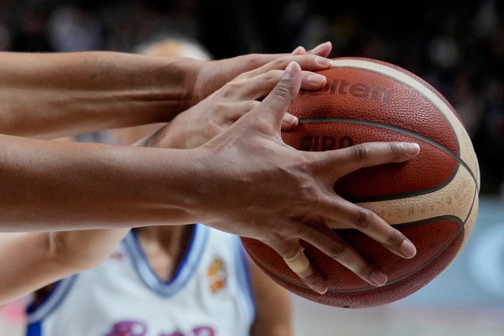Players reach for the ball during the Women's Basketball World Cup qualification playoff between Puerto Rico and China