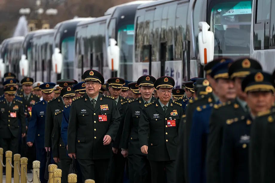Chinese army officers in line for a preparatory session of the People's Assembly in front of the Great Hall of the People.