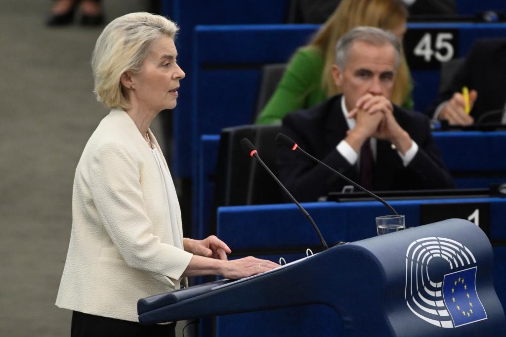 Canada's Prime Minister Mark Carney, left, listens to European Commission President Ursula von der Leyen