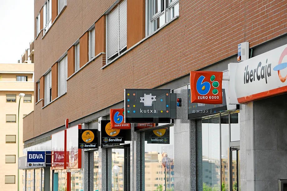 Several bank branches on a street in Madrid.