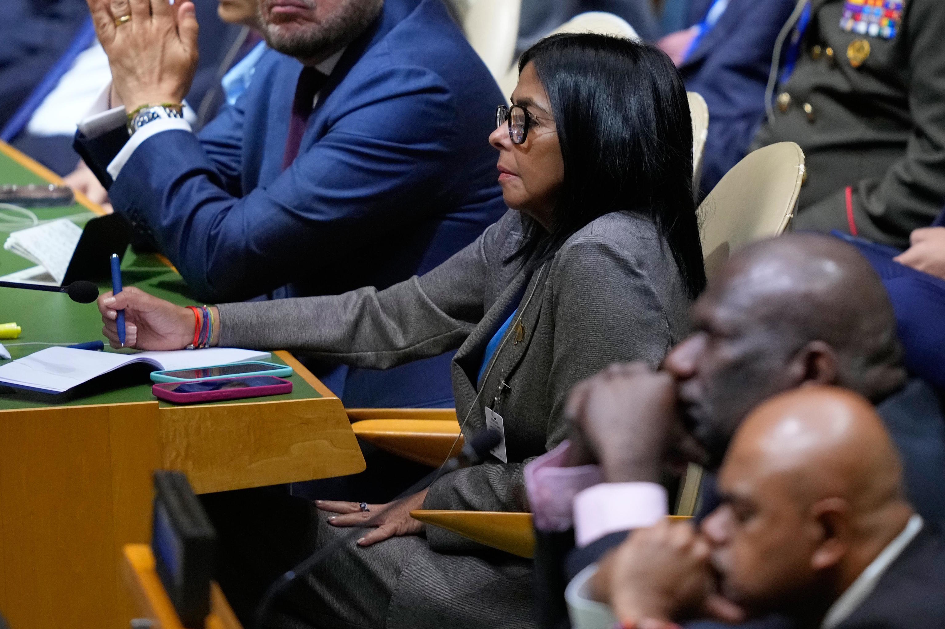 Venezuela's acting president Delcy Rodriguez listens as United States President Donald Trump.