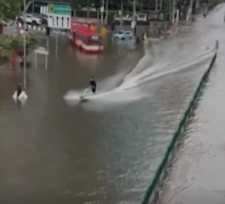 A Thai man using his jet ski during the serious floods in Bangkok