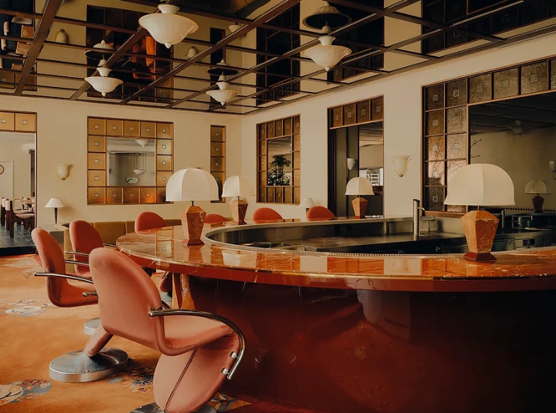 One of the bars&mdash;this one C-shaped&mdash;at the hotel, whose design is inspired by Art Nouveau and the music scene of the 1980s.