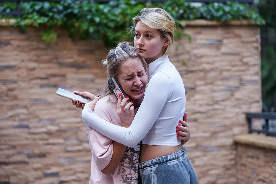 Two women react to the bombing in downtown Kiev.