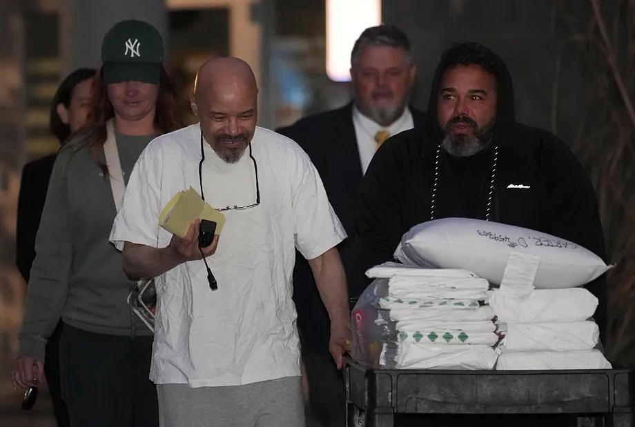 Douglas Stewart Carter and his son Tyler Anger leave the Utah County Jail this Monday.