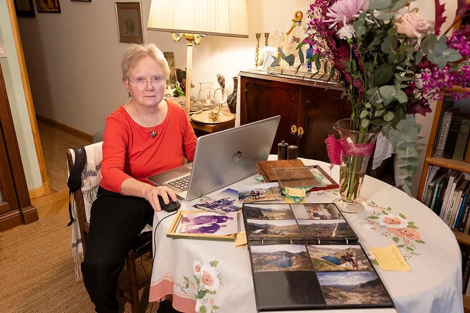 Elizabeth, reviewing her personal photo archive, at her home in Madrid.