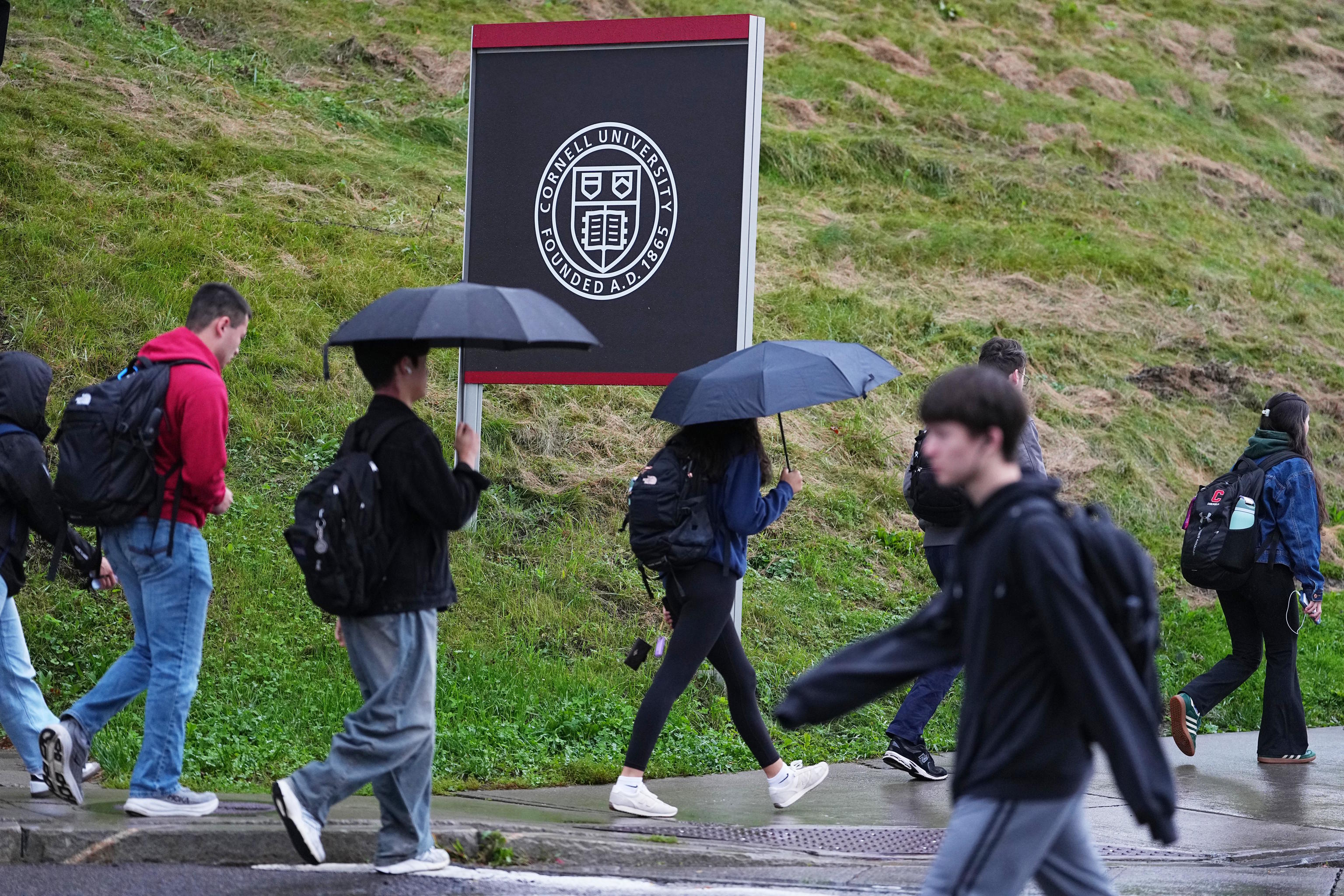 Students walk across the Cornell University campus in Ithaca, New York.