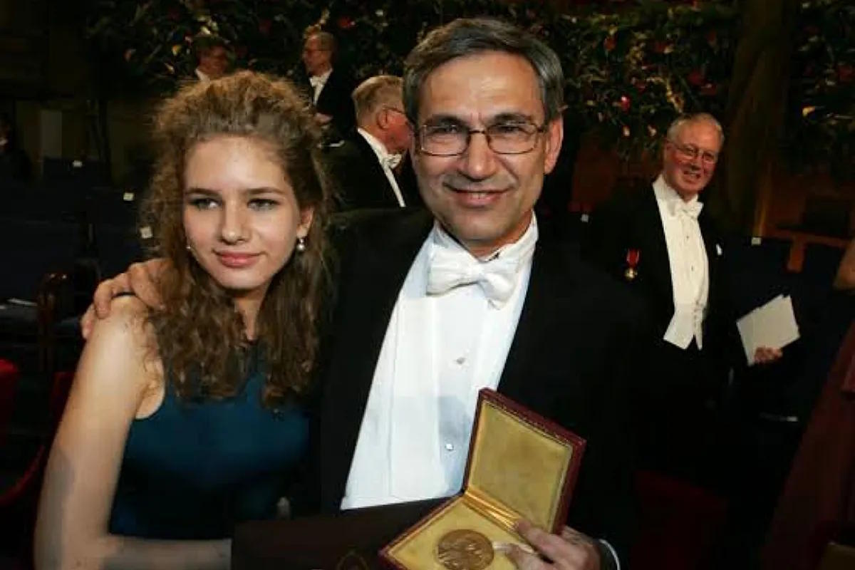 Pamuk posing with his daughter Ruya and the Nobel medal in Stockholm in 2006.