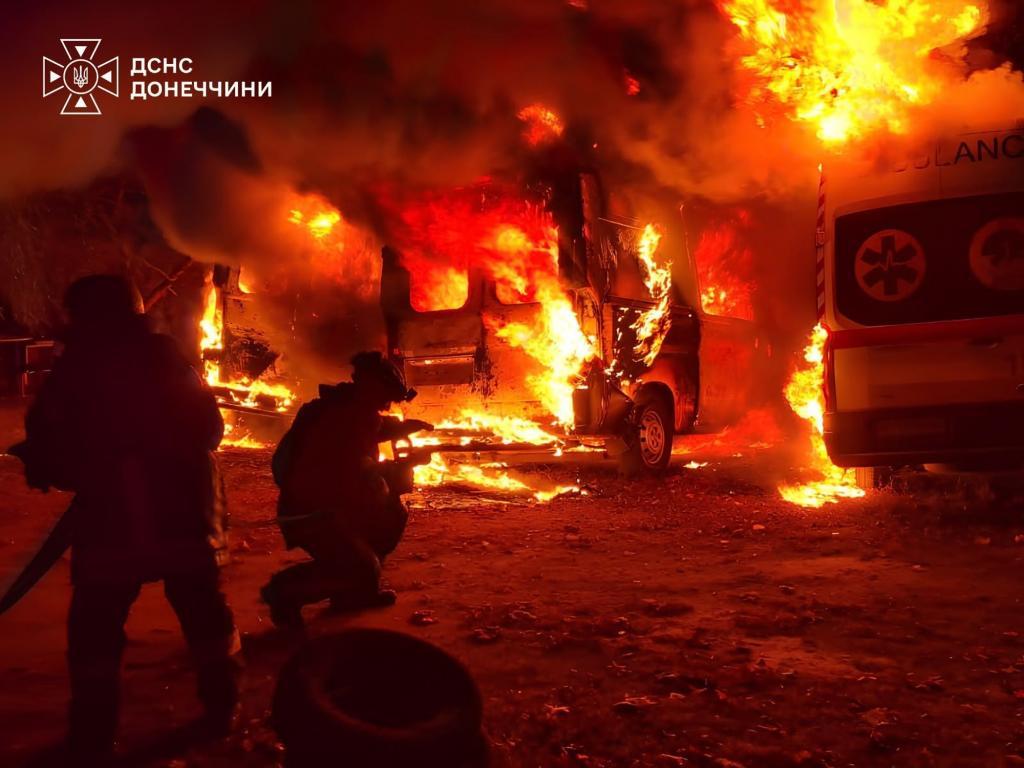 Rescue workers put out a fire of ambulances after a Russian strike on a medical facility of Kramatorsk