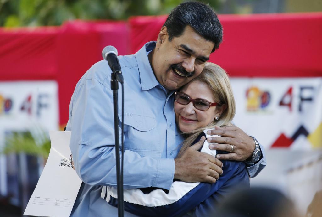 Venezuela's President Nicolas Maduro hugs first Lady Cilia Flores