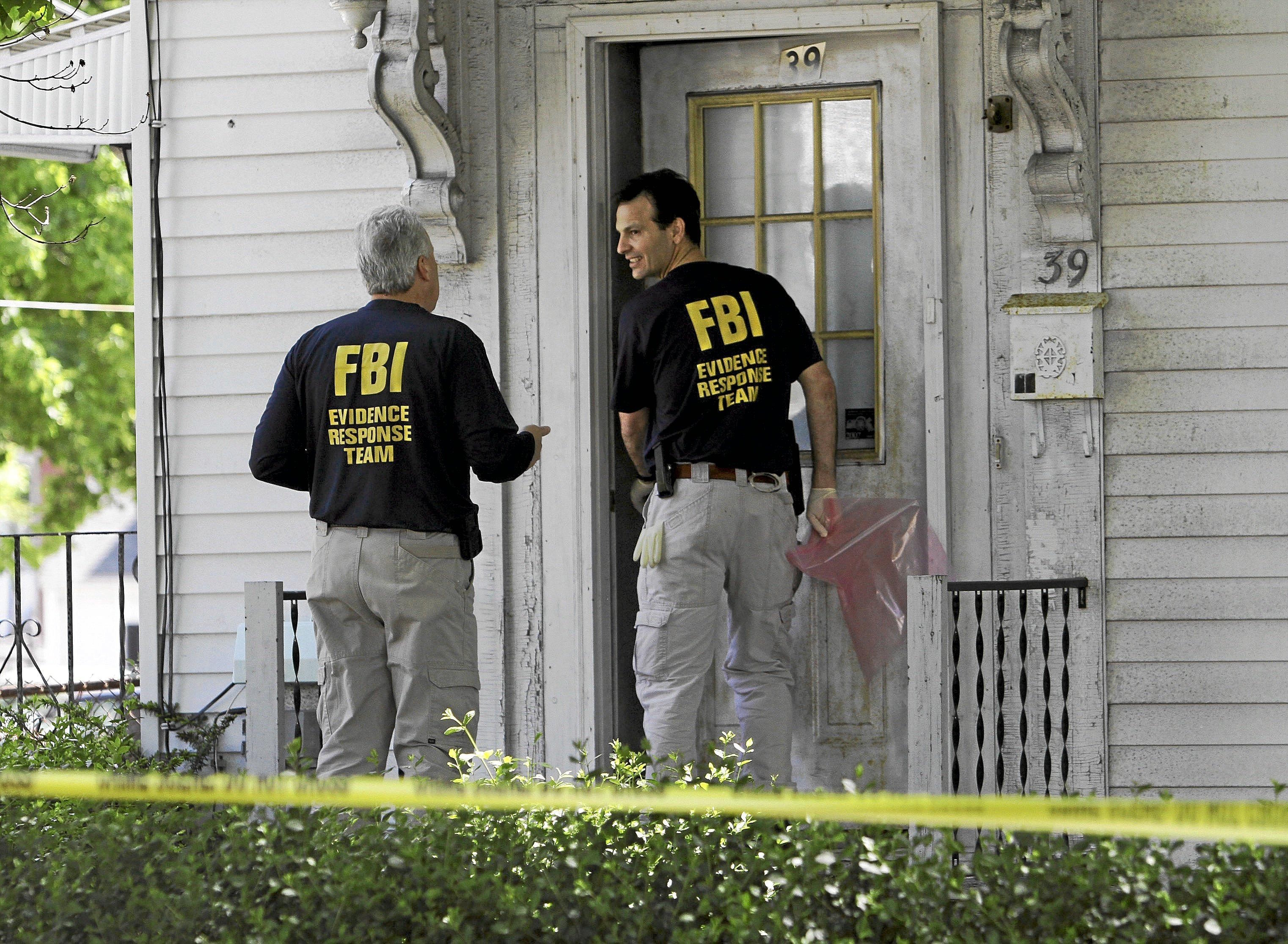 Police officers during a raid.
