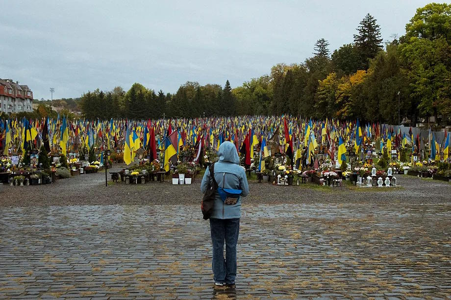 Lviv's military cemetery full of graves of soldiers who died during the nearly five years of war, with one flag for each deceased.