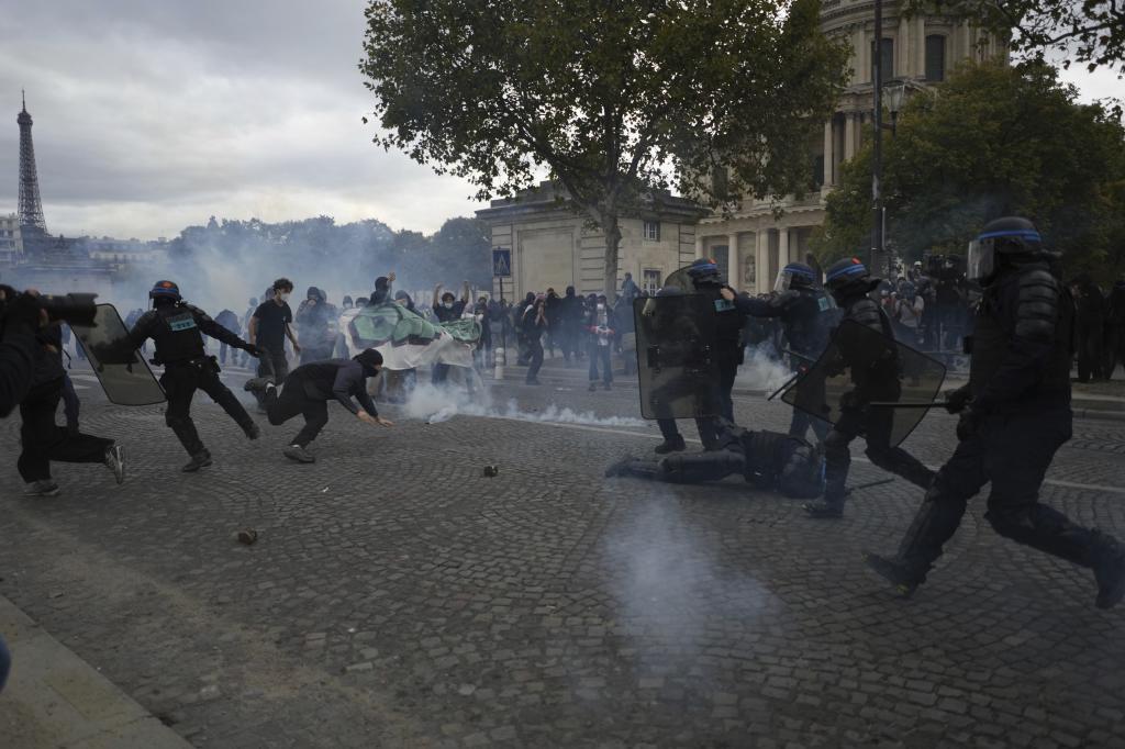 Police take on students after a march to protest against under-resourced schools in Paris