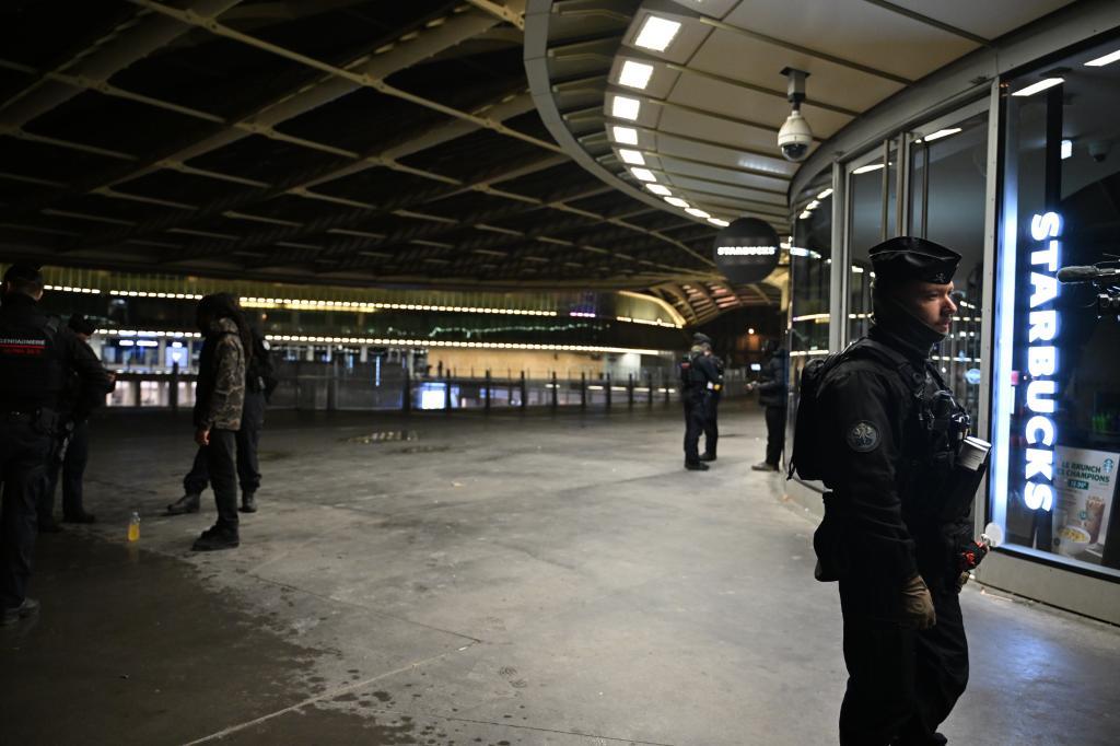 Policemen patrol during an overnight curfew in Paris