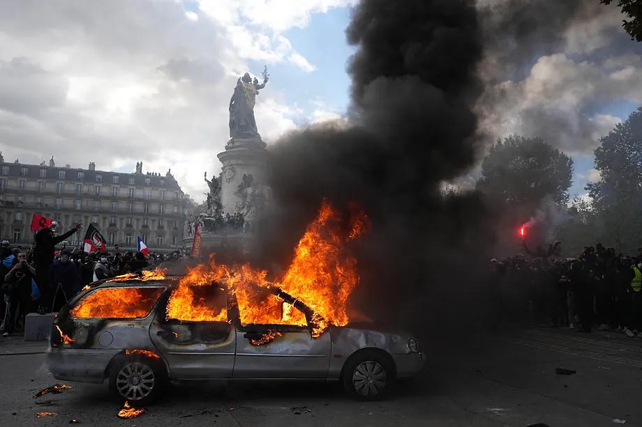 A car burns in Republic Square in Paris last Saturday.