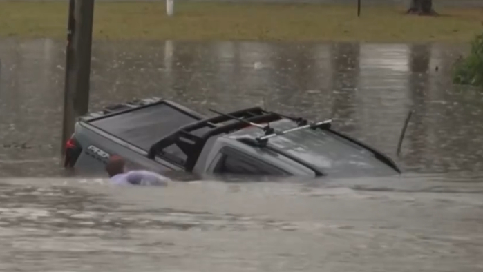 Reporter Will Murray interrupted his live broadcast in the town of Morayfield