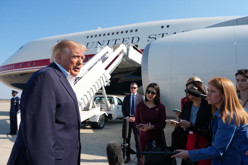 President Donald Trump speaks to media before boarding Air Force One