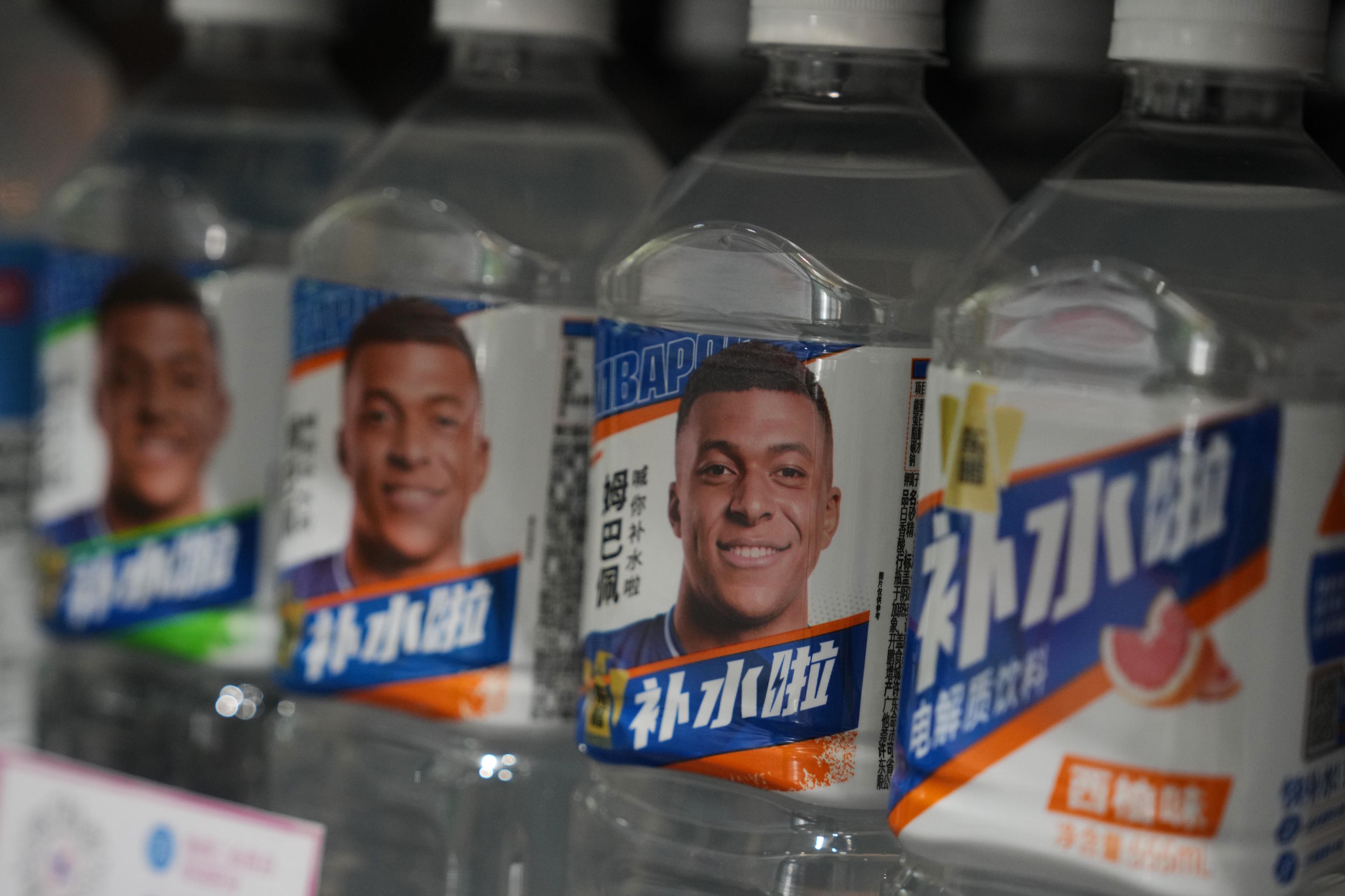 Bottles featuring an image of Mbapp� in a Beijing supermarket.