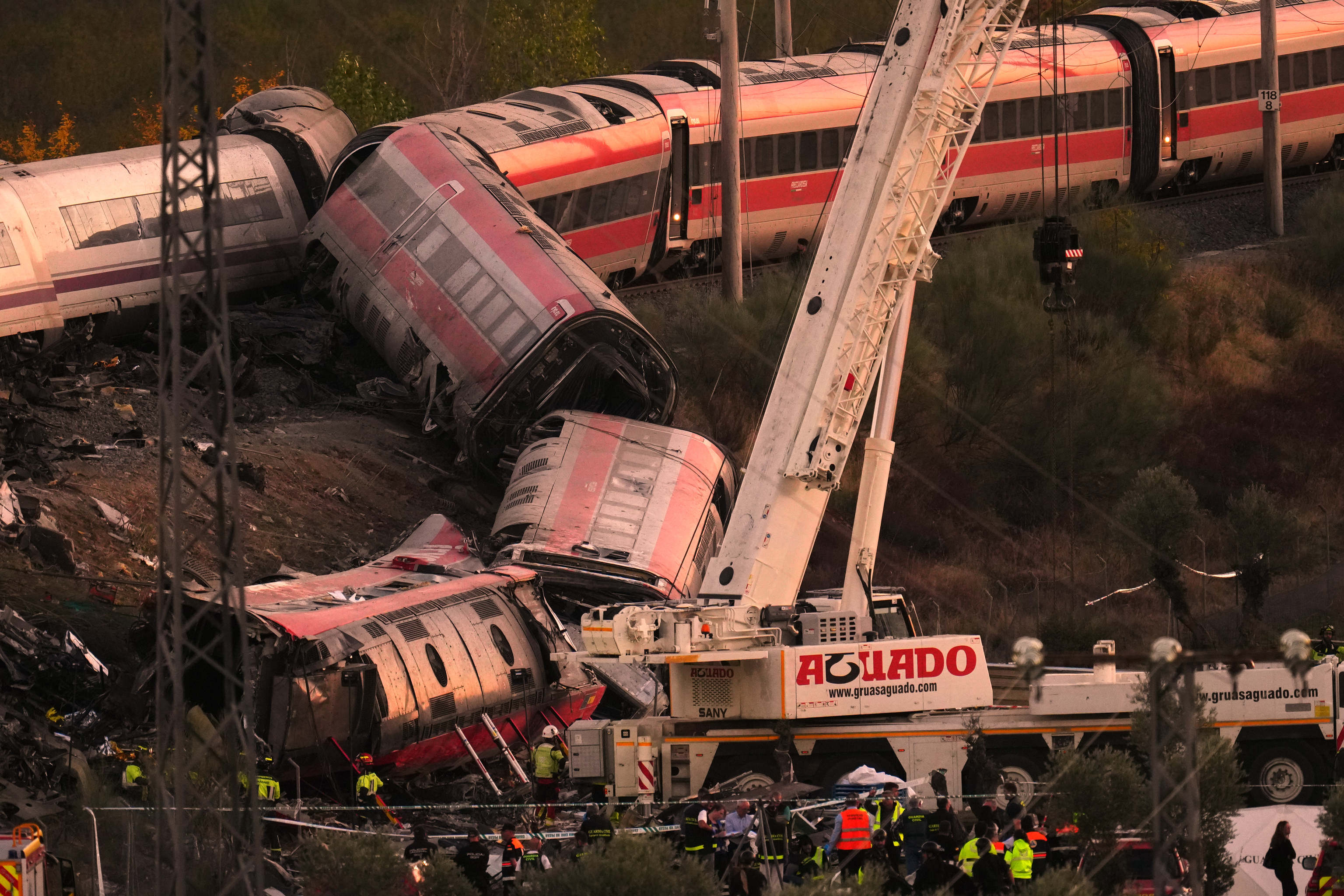 Emergency services work at the scene of a collision between two trains in Urda, Spain.